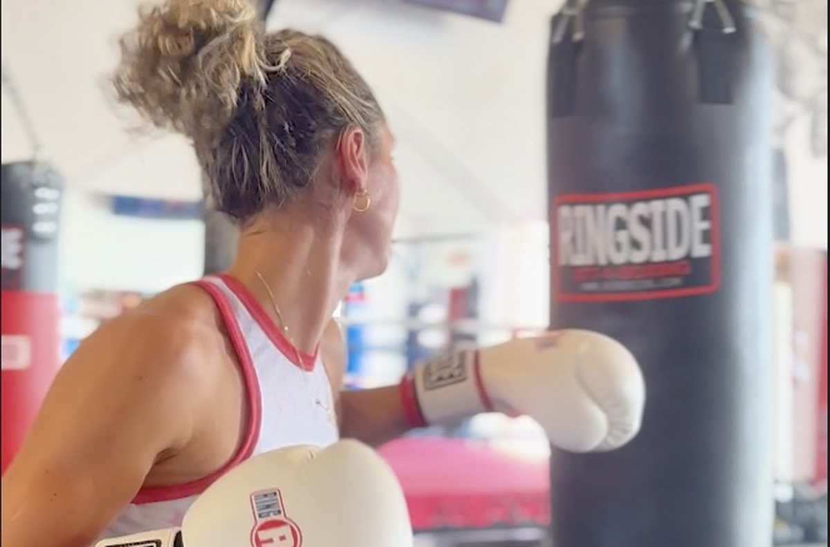 A member throwing a straight right on the heavy bag at Fortivus